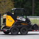 JCB 215T Compact Track Loader on a trailer.