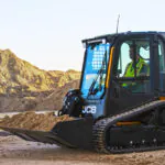 JCB 250T Compact Track Loader transporting dirt.