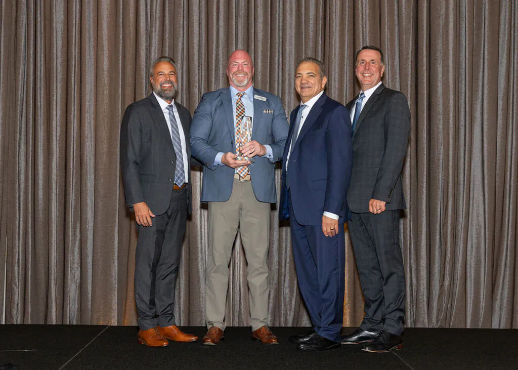 Fairchild Equipment's President, Van Clarkson, accepting the 2025 Hyster Dealer of Distinction award.