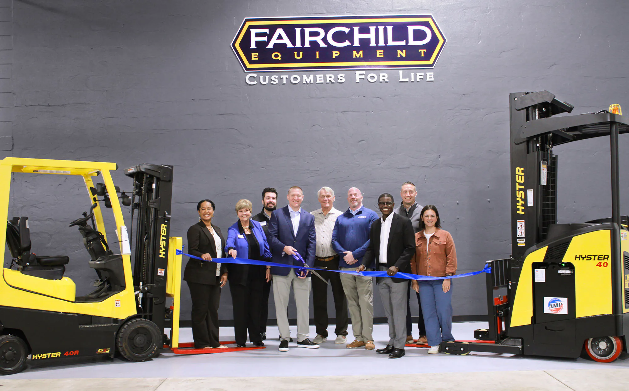Dora Drake, Ginger Kollmansberger, Ryan Rivas, Chad Fairchild, Gary Fairchild, Van Clarkson, David Crowley, Mike Duffek and Heather Hastings at Fairchild Equipment's Milwaukee Grand Opening.