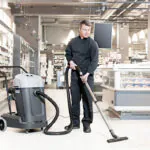 Advance VL500 industrial vacuum cleaning grocery store floors.