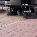 Nilfisk SW3000 sweeper cleaning dirt and debris.