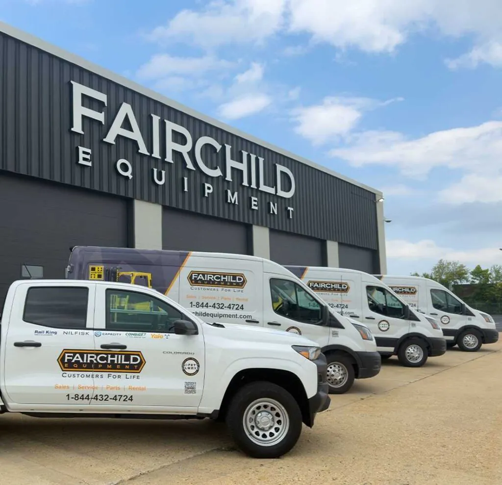 Fairchild Equipment mobile service fleet parked outside a Fairchild Equipment facility. Service trucks support forklift maintenance, material handling equipment service, parts, repairs, and customer support throughout the region.